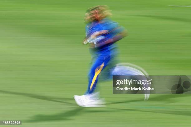 Lasith Malinga of Sri Lanka runs in to bowl during the 2015 Cricket World Cup match between Sri Lanka and Scotland at Bellerive Oval on March 11,...