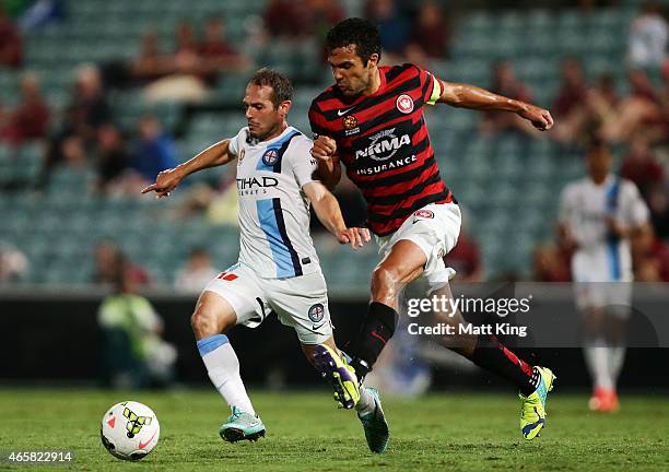 Massimo Murdocca of Melbourne City is challenged by Nikolai Topor-Stanley of the Wanderers during the round 21 A-League match between the Western...