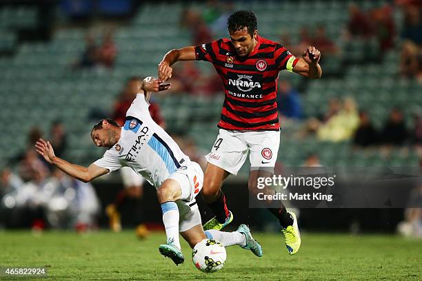 Massimo Murdocca of Melbourne City is tackled by Nikolai Topor-Stanley of the Wanderers during the round 21 A-League match between the Western Sydney...