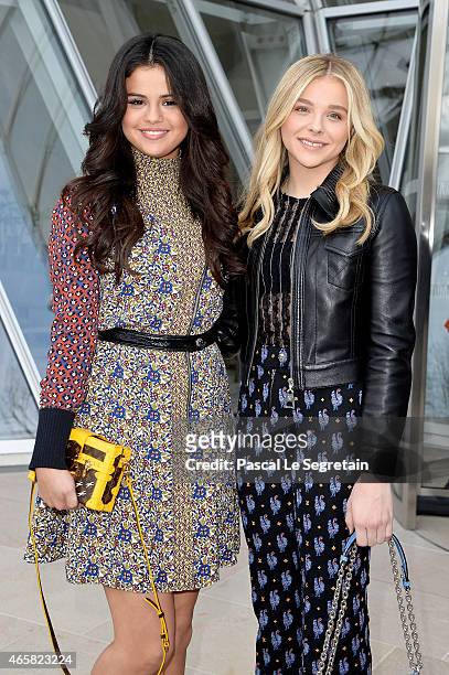 Selena Gomez and Chloe Moretz attend the Louis Vuitton show as part of the Paris Fashion Week Womenswear Fall/Winter 2015/2016 on March 11, 2015 in...