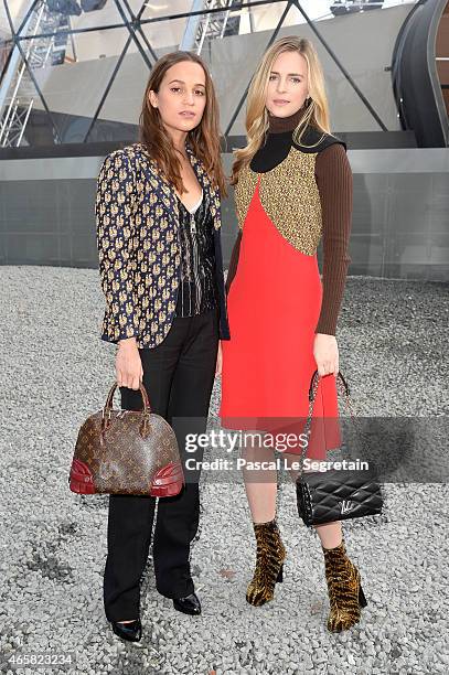 Alicia Vikander and Brit Marling attend the Louis Vuitton show as part of the Paris Fashion Week Womenswear Fall/Winter 2015/2016 on March 11, 2015...