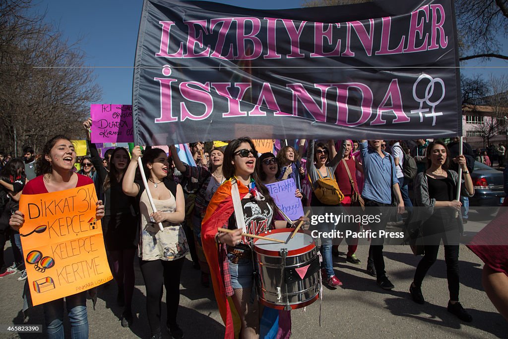 Women under a banner reading Lesbians revolt play...