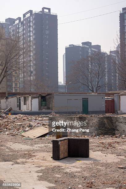 Abandoned sofa on the demolished land, which will be a residential construction site. In 2015, China will take measures to counter housing market...
