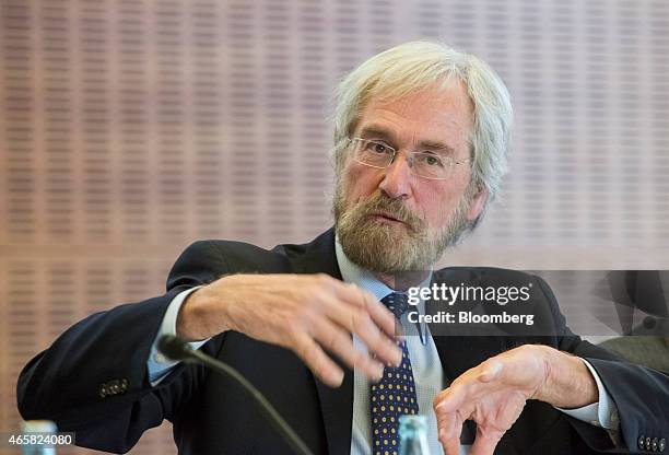 Peter Praet, chief economist at the European Central Bank , gestures as he addresses the European Central Bank and its watchers conference in...