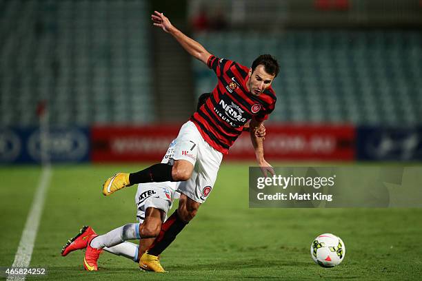 Labinot Haliti of the Wanderers is challenged by Safuwan Baharudin of Melbourne City during the round 21 A-League match between the Western Sydney...