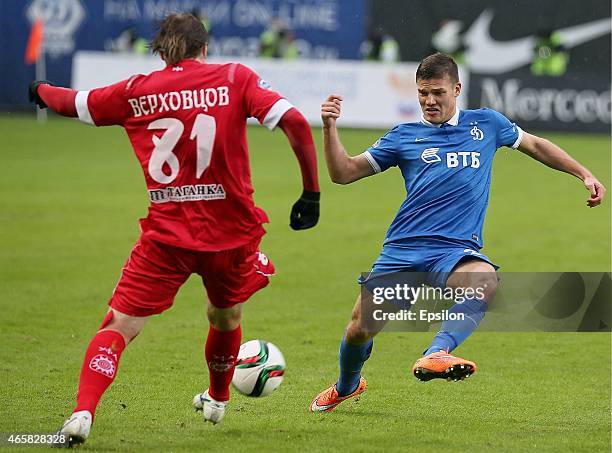 Igor Denisov of FC Dinamo Moscow challenged by Dmitry Verkhovtsov of FC Ufa Ufa during the Russian Premier League match between FC Dinamo Moscow and...
