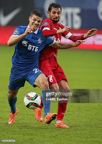 Igor Denisov of FC Dinamo Moscow challenged by Igor Shevchenko of FC Ufa Ufa during the Russian Premier League match between FC Dinamo Moscow and FC...