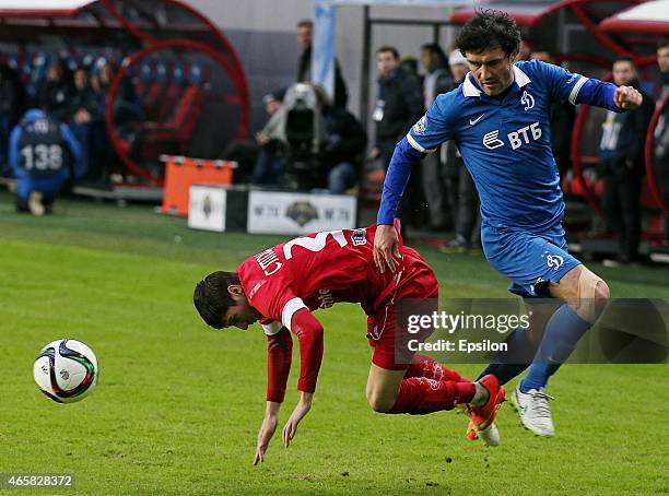 Yuri Zhirkov of FC Dinamo Moscow challenged by Dmitri Stotskiy of FC Ufa Ufa during the Russian Premier League match between FC Dinamo Moscow and FC...