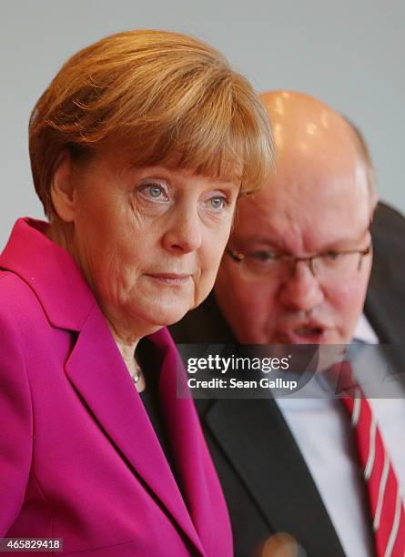 German Chancelleor Angela Merkel and Minister of the Chancellery Peter Altmeier attend the weekly German government cabinet meeting on March 11, 2015...