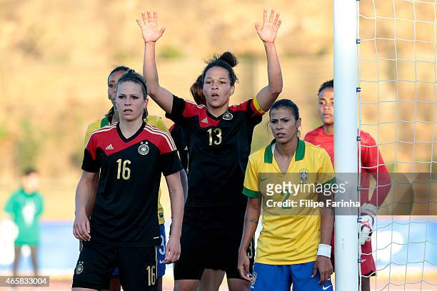 Melanie Leupolz and Celia Sasic of Germany during the Women's Algarve Cup match between Brazil and Germany on March 9, 2015 in Parchal, Portugal.