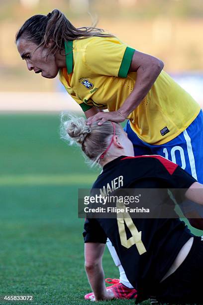 Marta Silva of Brazil pushes down Leonie Maier of Germany during the Women's Algarve Cup match between Brazil and Germany on March 9, 2015 in...