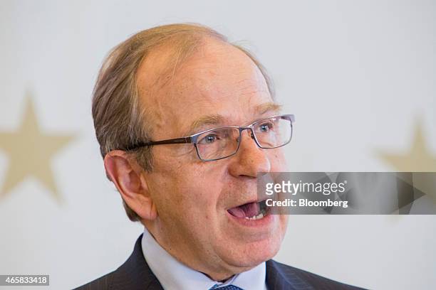 Erkki Liikanen, governor of the Bank of Finland, speaks as he addresses the European Central Bank and its watchers conference in Frankfurt, Germany,...
