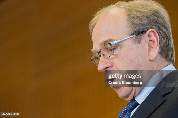 Erkki Liikanen, governor of the Bank of Finland, speaks as he addresses the European Central Bank and its watchers conference in Frankfurt, Germany,...