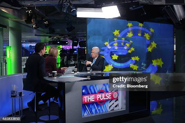 Mario Monti, Italy's former prime minister, right, speaks during a Bloomberg Television interview in London, U.K., on Wednesday, March 11, 2015....