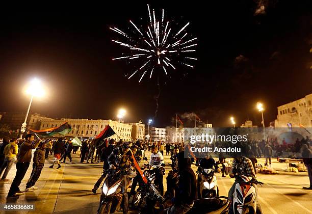 Libyan football fans celebrate in Martyrs' Square after their national team defeated Zimbabwe in the African Nations Championship semi-final football...