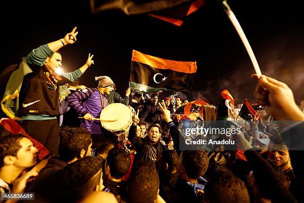 Libyan football fans celebrate in Martyrs' Square after their national team defeated Zimbabwe in the African Nations Championship semi-final football...