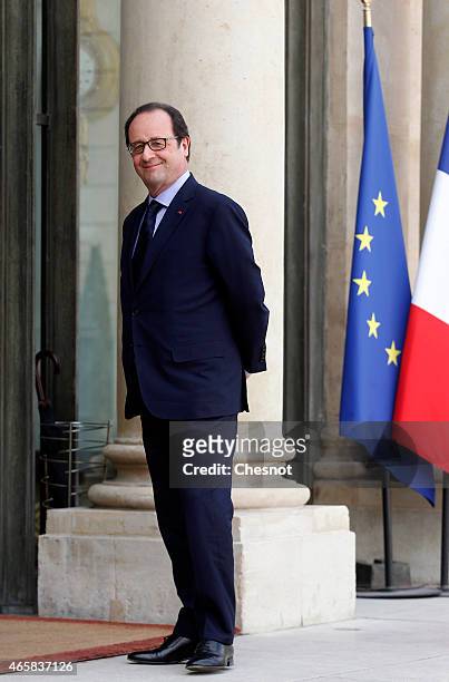 French President Francois Hollande waits for a meeting with Mario Draghi, president of the European Central Bank at the Elysee Palace on March 11,...