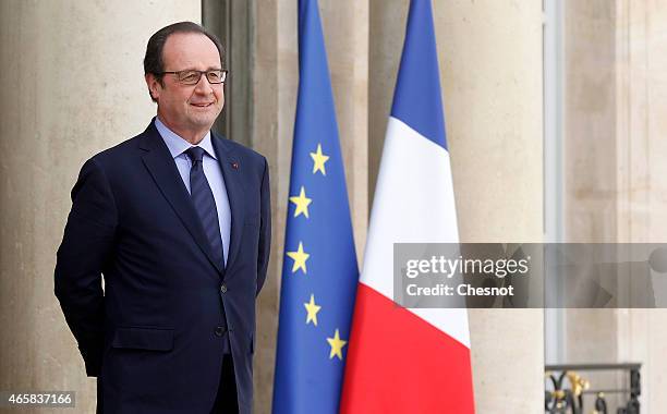 French President Francois Hollande waits for a meeting with Mario Draghi, president of the European Central Bank at the Elysee Palace on March 11,...