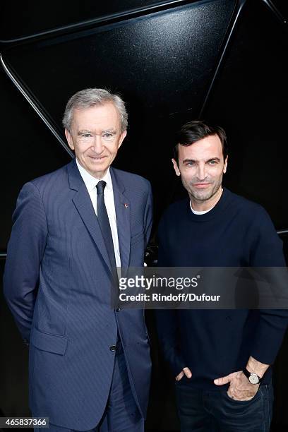 Owner of LVMH Luxury Group Bernard Arnault and Fashion Designer Nicolas Ghesquiere pose after the Louis Vuitton show as part of the Paris Fashion...