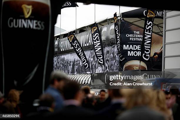 Racegoers make their way to the Guinness village at Cheltenham racecourse on March 11, 2015 in Cheltenham, England.