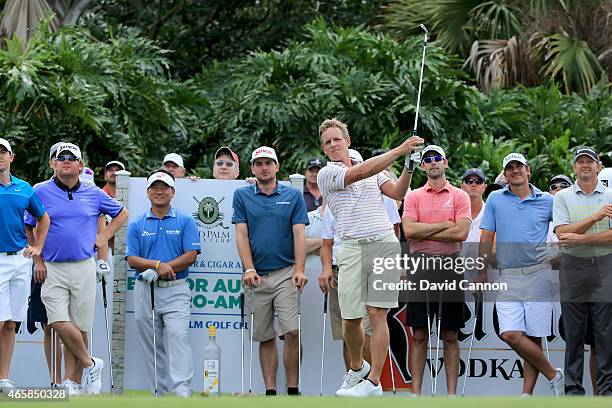 Luke Donald of England plays his shot during the $2 Million Kettle One Vodka Challenge on the 120 yards par 3, 19th hole at The Old Palm CC during...