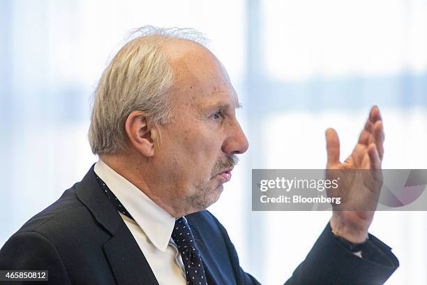 Ewald Nowotny, governor of Austria's central bank, gestures as he addresses the European Central Bank and its watchers conference in Frankfurt,...