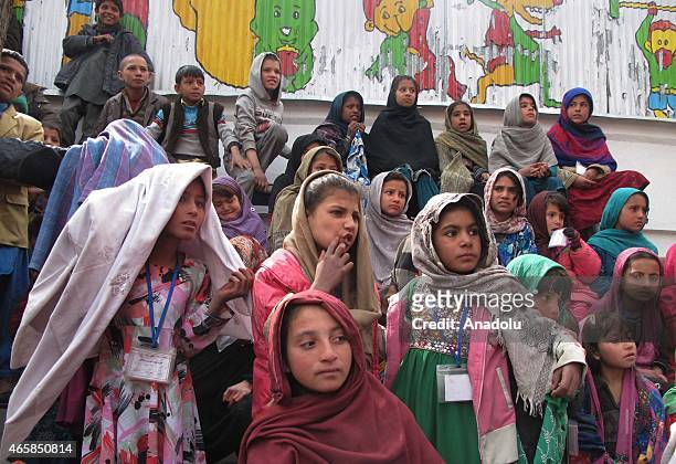 Internally displaced Afghan children attend a graduation ceremony organized by the Mobile Mini Circus for Children in Kabul, Afghanistan March 11,...