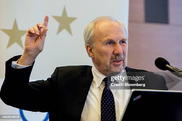 Ewald Nowotny, governor of Austria's central bank, gestures as he addresses the European Central Bank and its watchers conference in Frankfurt,...