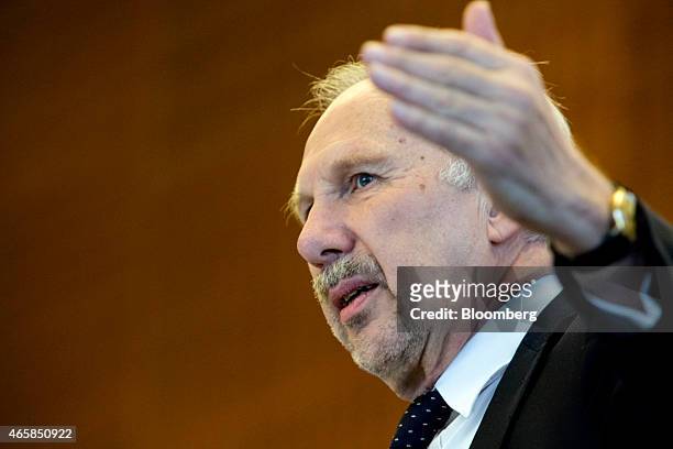 Ewald Nowotny, governor of Austria's central bank, gestures as he addresses the European Central Bank and its watchers conference in Frankfurt,...