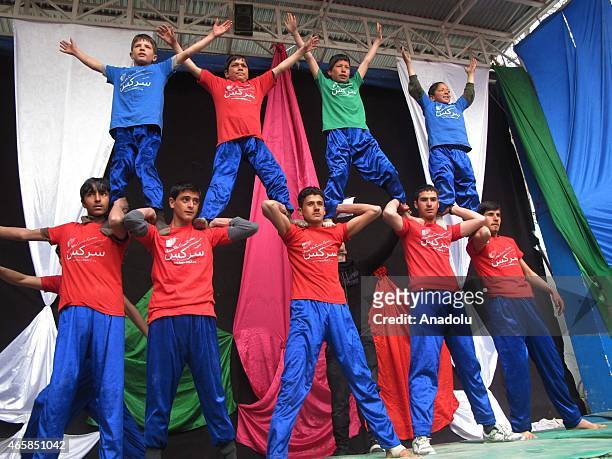 Internally displaced Afghan children perform during a graduation ceremony organized by the Mobile Mini Circus for Children in Kabul, Afghanistan...