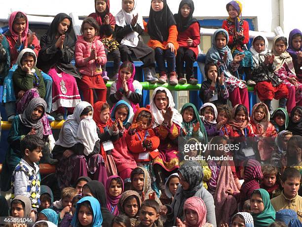 Internally displaced Afghan children attend a graduation ceremony organized by the Mobile Mini Circus for Children in Kabul, Afghanistan March 11,...