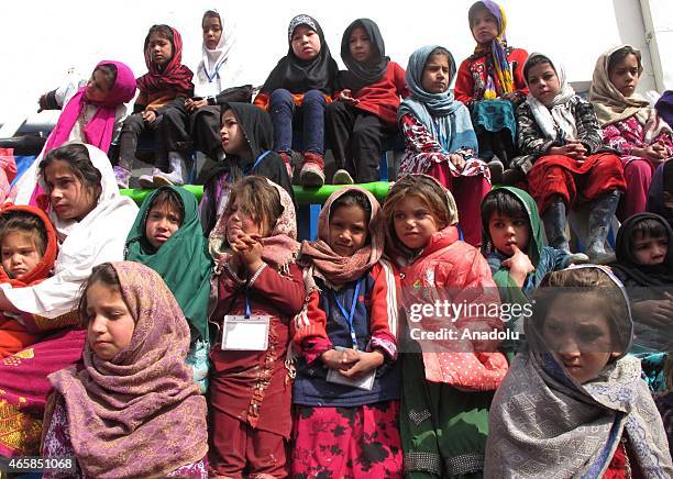 Internally displaced Afghan children attend a graduation ceremony organized by the Mobile Mini Circus for Children in Kabul, Afghanistan March 11,...