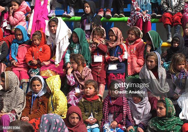 Internally displaced Afghan children attend a graduation ceremony organized by the Mobile Mini Circus for Children in Kabul, Afghanistan March 11,...