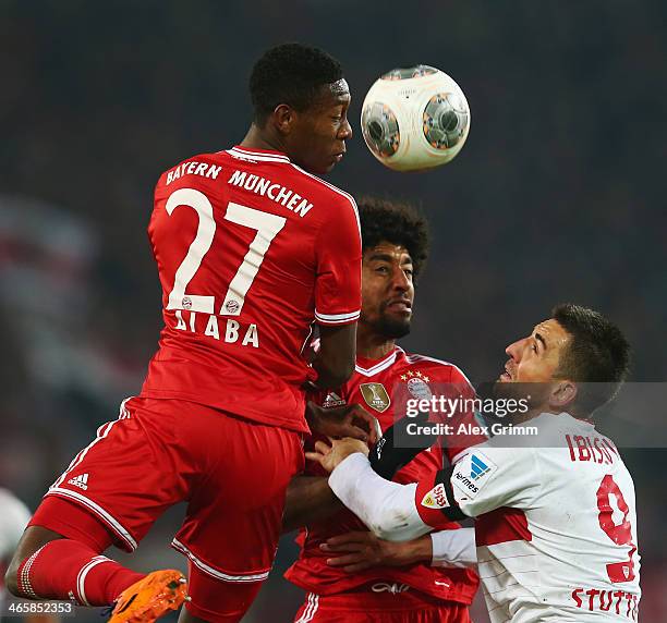 Vedad Ibisevic of Stuttgart is challenged by Dante and David Alaba of Muenchen during the Bundesliga match between VfB Stuttgart and FC Bayern...