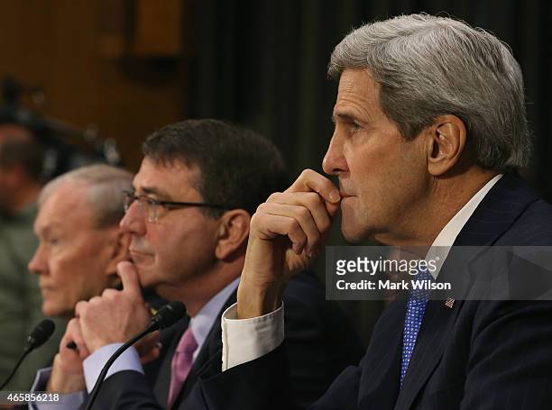 Secretary of State John Kerry , Defense Secretary Ashton Carter and Chairman of the Joint Chiefs of Staff Gen. Martin Dempsey listen to questions...