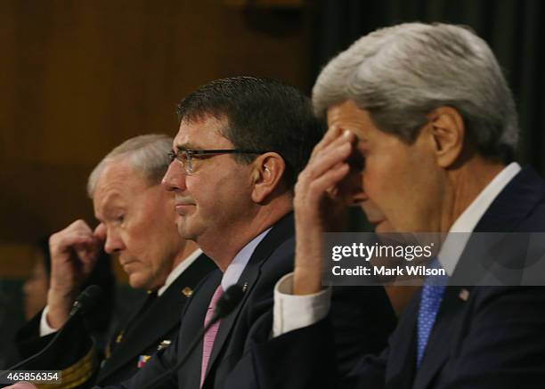 Secretary of State John Kerry , Defense Secretary Ashton Carter and Chairman of the Joint Chiefs of Staff Gen. Martin Dempsey listens to questions...