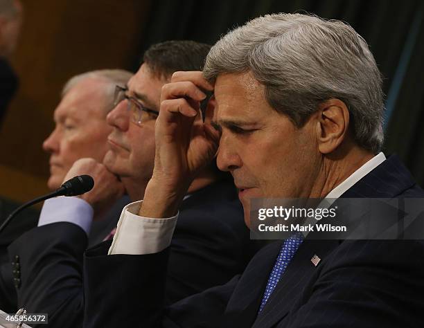 Secretary of State John Kerry , Defense Secretary Ashton Carter and Chairman of the Joint Chiefs of Staff Gen. Martin Dempsey listen to questions...