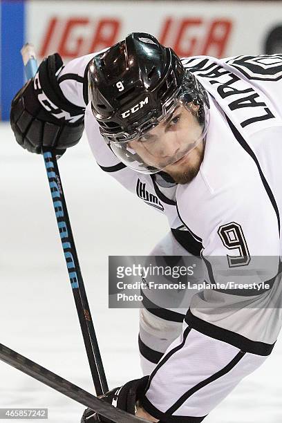 Yan Pavel Laplante of the Gatineau Olympiques takes a face-off against the Rimouski Oceanic during a game on February 22, 2015 at Robert Guertin...