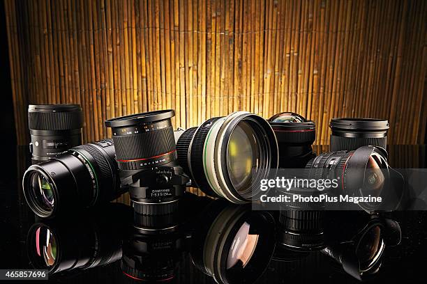 Selection of Canon DSLR-compatible lenses, including fisheye, tilt shift and telephoto lenses, taken on June 12, 2014.