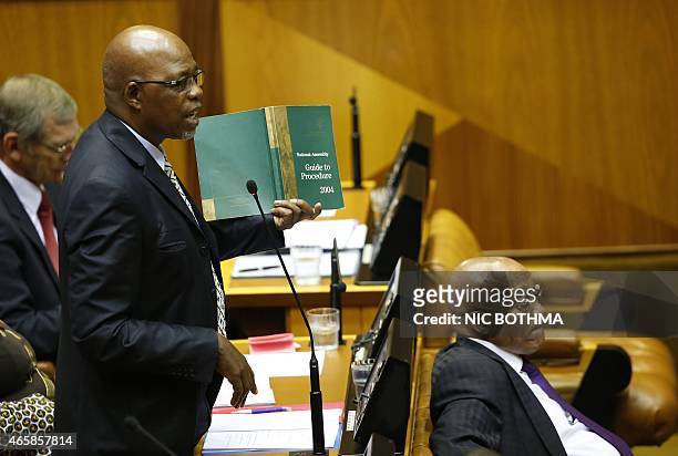 Ruling party African National Congress chief whip Stone Sizane and South African president Jacob Zuma take part in a question and answer session at...