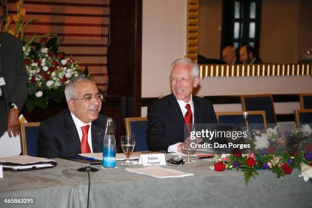 Former Prime Minister of the Palestinian Authority Salam Fayyad talks as former Governor of the Bank of Israel Professor Stanley Fischer laughs...