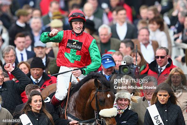 Sam Twiston-Davies celebrates after riding Dodging Bulletts to victory in the Betway Queen Mother Champion Steeple Chase during day two of the...
