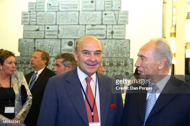 Former Argentinean Finance Minister Domingo Cavallo poses with President of Israel Shimon Peres during a conference of the Group of Thirty hosted by...