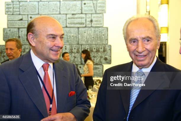 Former Argentinean Finance Minister Domingo Cavallo poses with President of Israel Shimon Peres during a conference of the Group of Thirty hosted by...