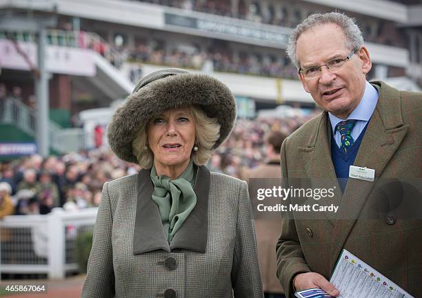 Camilla, Duchess of Cornwall is shown around the paddock by Chairman of Cheltenham racecourse Robert Waley-Cohen on the second day of the Cheltenham...