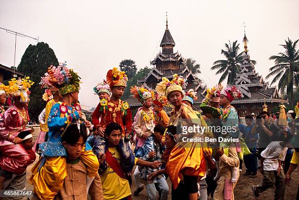 Novices dressed like princes are carried around Wat Hua Wiang by their friends and family as part of the annual Poi Sang Long procession to celebrate...