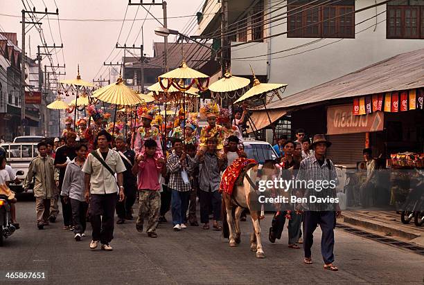 Horse leads a procession of novices around the streets of Mae Hong Son in Northern Thailand as part of the annual Poi Sang Long procession to...