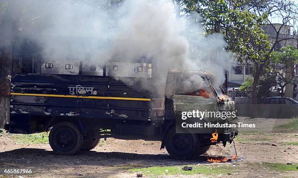 Police van set on fire by angry lawyers outside the district court after a police inspector shot a lawyer in the court premises on March 11, 2015 in...