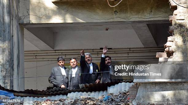 Lawyers watching from a balcony during clash between lawyers and police after a police official shot dead a lawyer and injured another outside the...