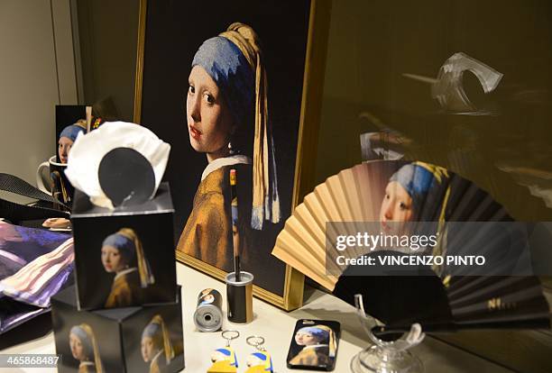 Photo taken on January 30, 2014 shows merchandise featuring the masterpiece "Girl with a Pearl Earring" by Dutch painter Johannes Vermeer during a...